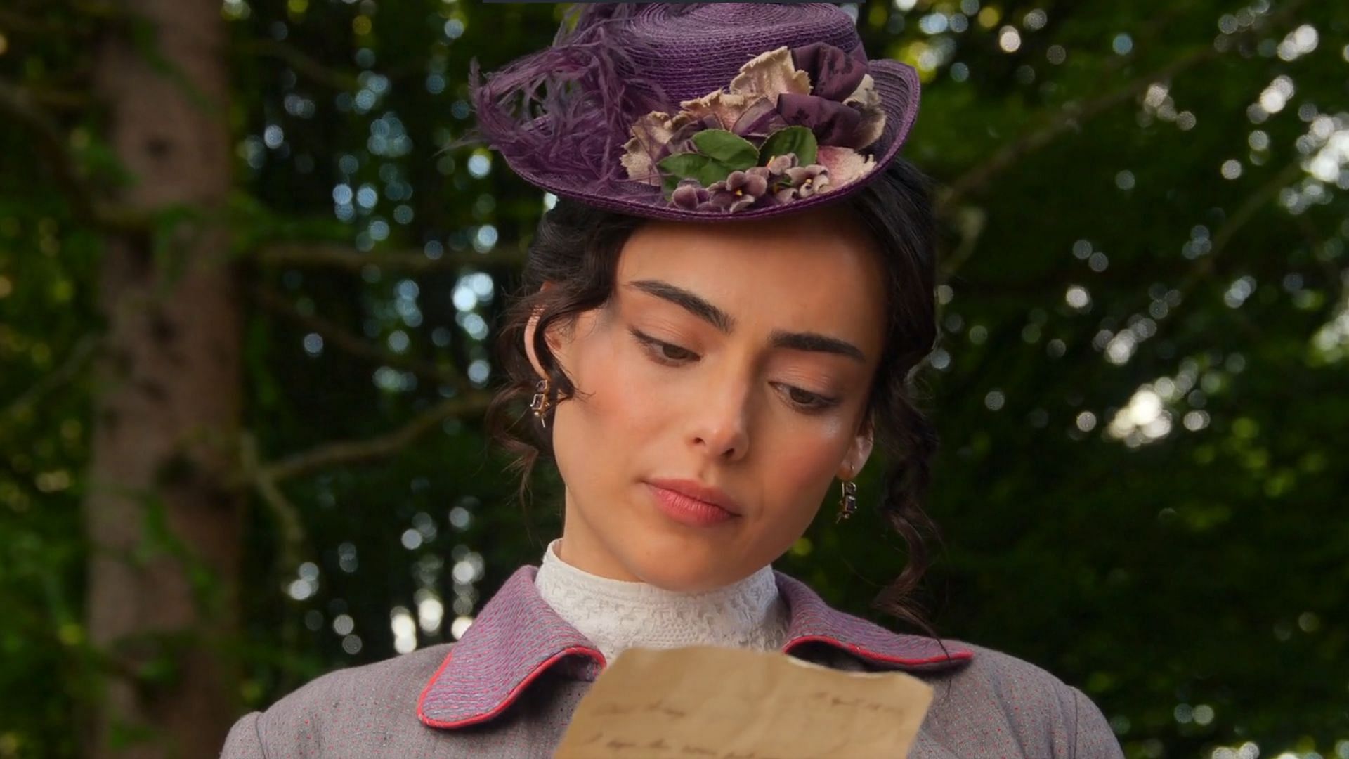 Lizzy receives Guy's letter in The Buccaneers season 2 episode 2 (Image via Apple TV+)